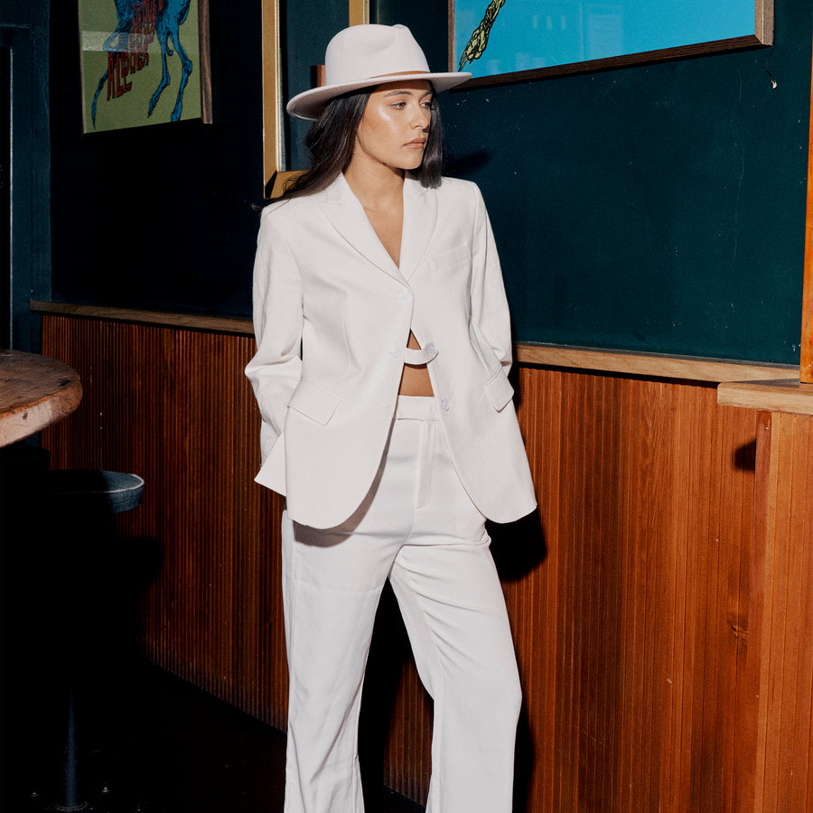 Model wears the Oslo Fedora in White at the Gum Bar in Melbourne