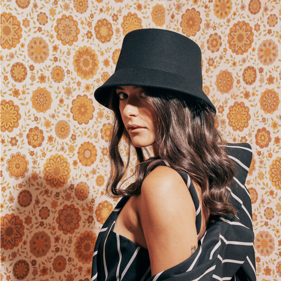 Model, Tessa Edwards, wears the Ace of Something Seine Bucket Hat in Black