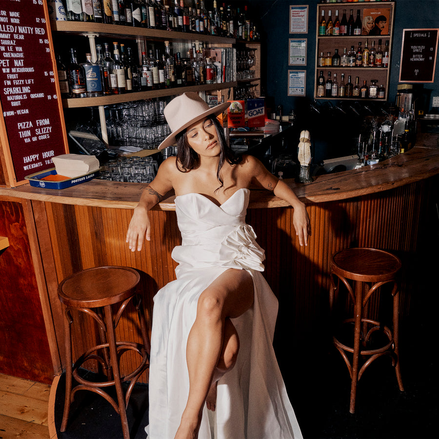 Model, Tessa Edwards, wears the Ace Of Something Amie Fedora in Beige at the Collingwood Bar, Gum